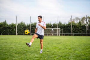 Man juggling a soccer ball to improve his first touch