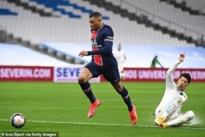 Kylian Mbappe sprinting in soccer